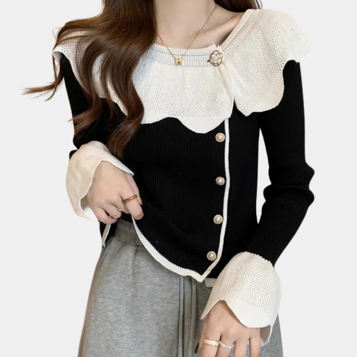 Zwart-witte damestrui met knopen en ruches, elegante stijl, lange mouwen, geschikt voor herfstmode, trendy kleding voor vrouwen.