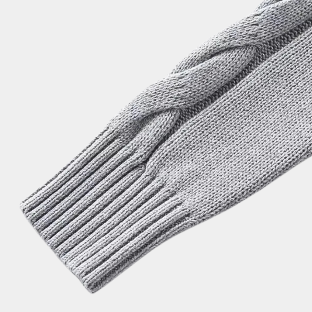 Grijze gebreide mouw met kabelpatroon, hoogwaardige wol, wintermode, warme trui, stijlvol en comfortabel, geschikt voor koude seizoenen.