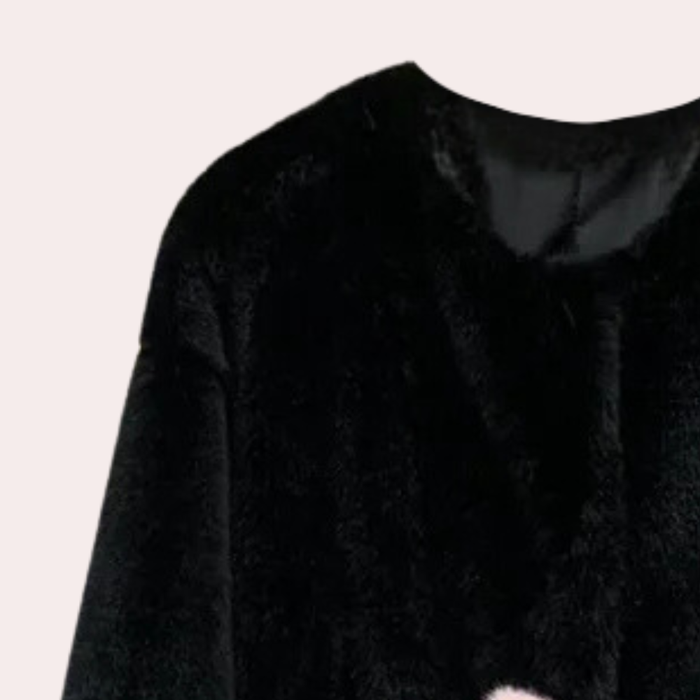 Zwarte faux bontjas voor dames, stijlvolle wintermode, warme en luxe uitstraling, perfect voor koude seizoenen, trendy en elegant design.