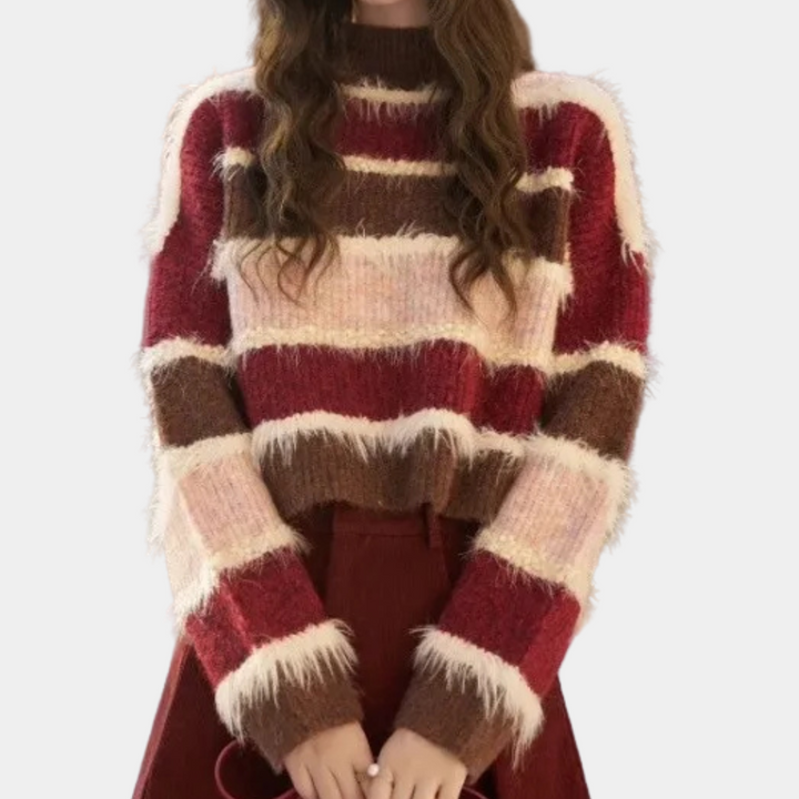 Damestrui met roze, rode en bruine strepen, pluizige textuur, lange mouwen, ideaal voor herfstmode. Trendy en comfortabel kledingstuk.