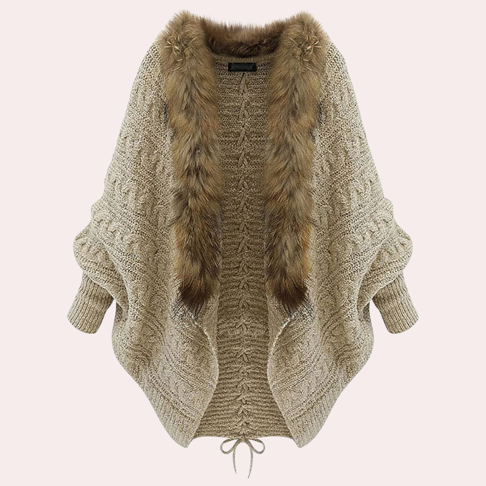 Beige gebreid vest met kunstbontkraag, vleermuismouwen en trekkoord. Stijlvol dameskledingstuk, perfect voor herfst- en wintermode.