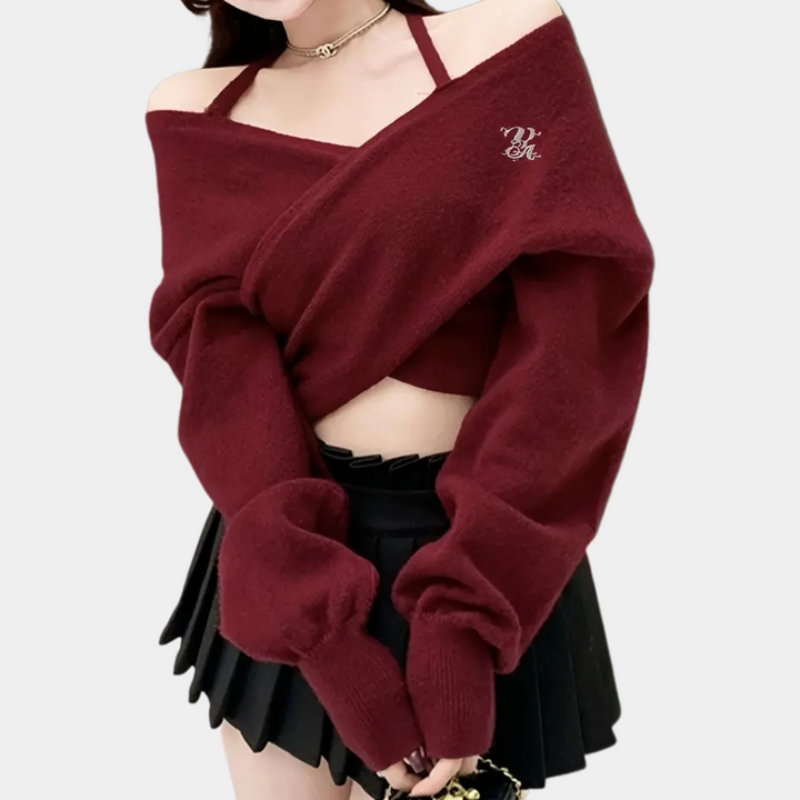 Vrouw in bordeauxrode off-shoulder trui met zwarte plooirok, trendy herfstmode, stijlvolle dameskleding, casual chique outfit.