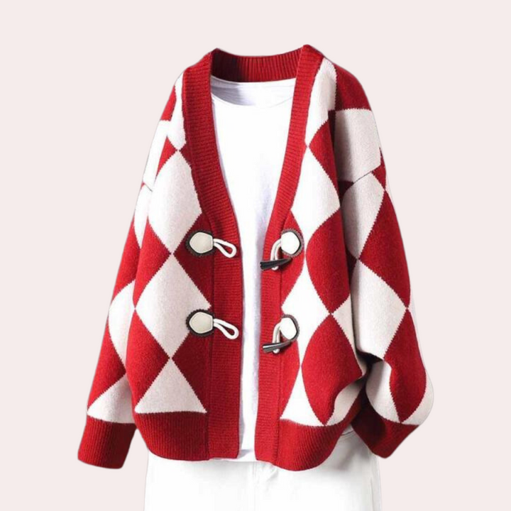 Rode en witte ruitjes cardigan met oversized pasvorm en unieke knoopsluiting, perfect voor herfstmode. Stijlvolle dameskleding, trendy en comfortabel.