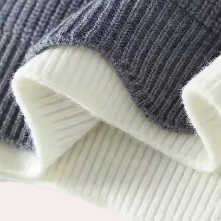 Grijze en witte geribbelde stof, close-up. Hoogwaardige textieltextuur, geschikt voor mode, kleding en interieurontwerp.