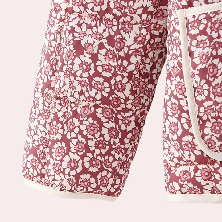 Roze en witte bloemenprint gewatteerde jas met zakken, trendy damesmode, comfortabele winterkleding, stijlvolle en warme jas voor dagelijks gebruik.