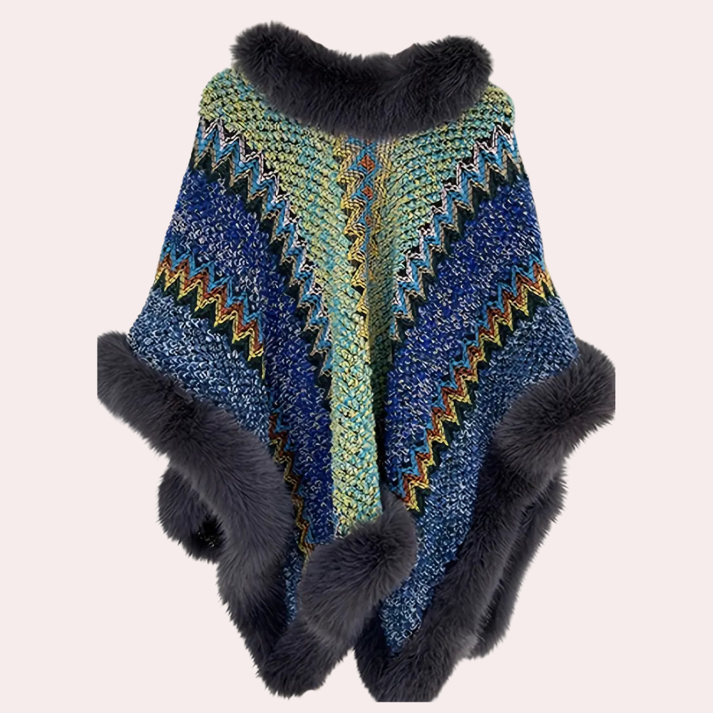 Kleurrijke gebreide poncho met zigzagpatroon en donzige rand, perfect voor wintermode. Stijlvolle dameskleding, warme en modieuze poncho.