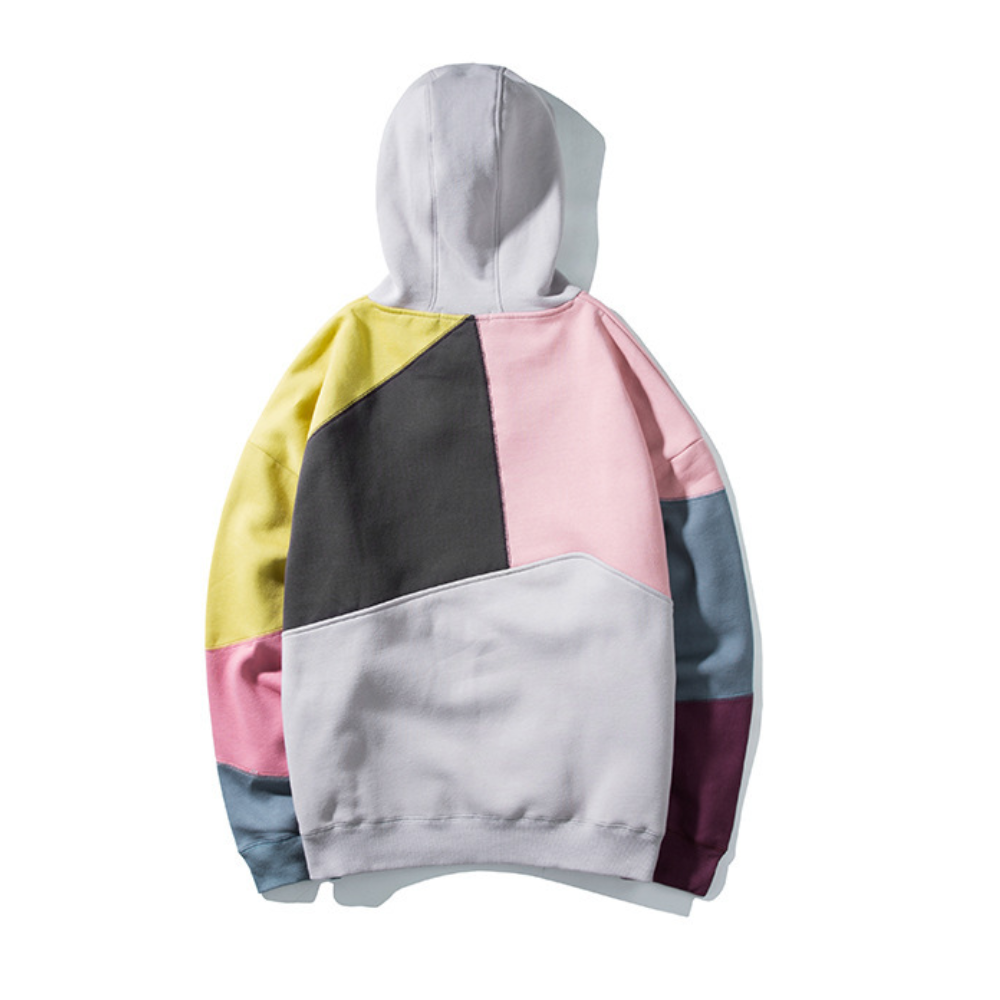 Kleurrijke patchwork hoodie met geometrisch ontwerp, unisex mode, casual streetwear, zachte katoenen stof, trendy kleding voor herfst en winter.