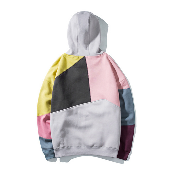 Kleurrijke patchwork hoodie met geometrisch ontwerp, unisex mode, casual streetwear, zachte katoenen stof, trendy kleding voor herfst en winter.