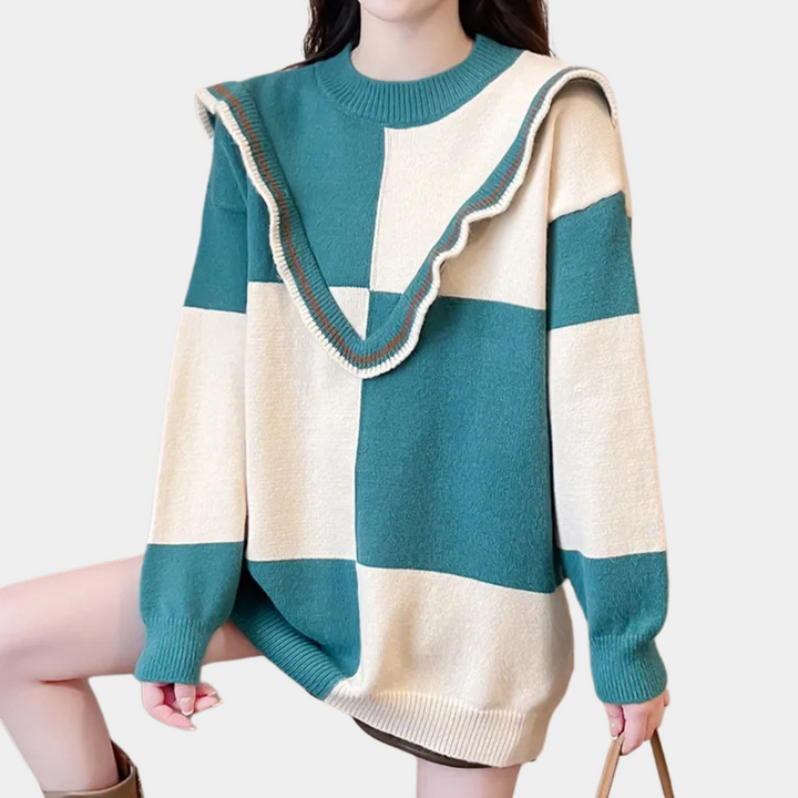 Damestrui met ruitpatroon in groen en beige, lange mouwen, ronde hals en decoratieve ruches. Modieuze oversized stijl voor herfst en winter.