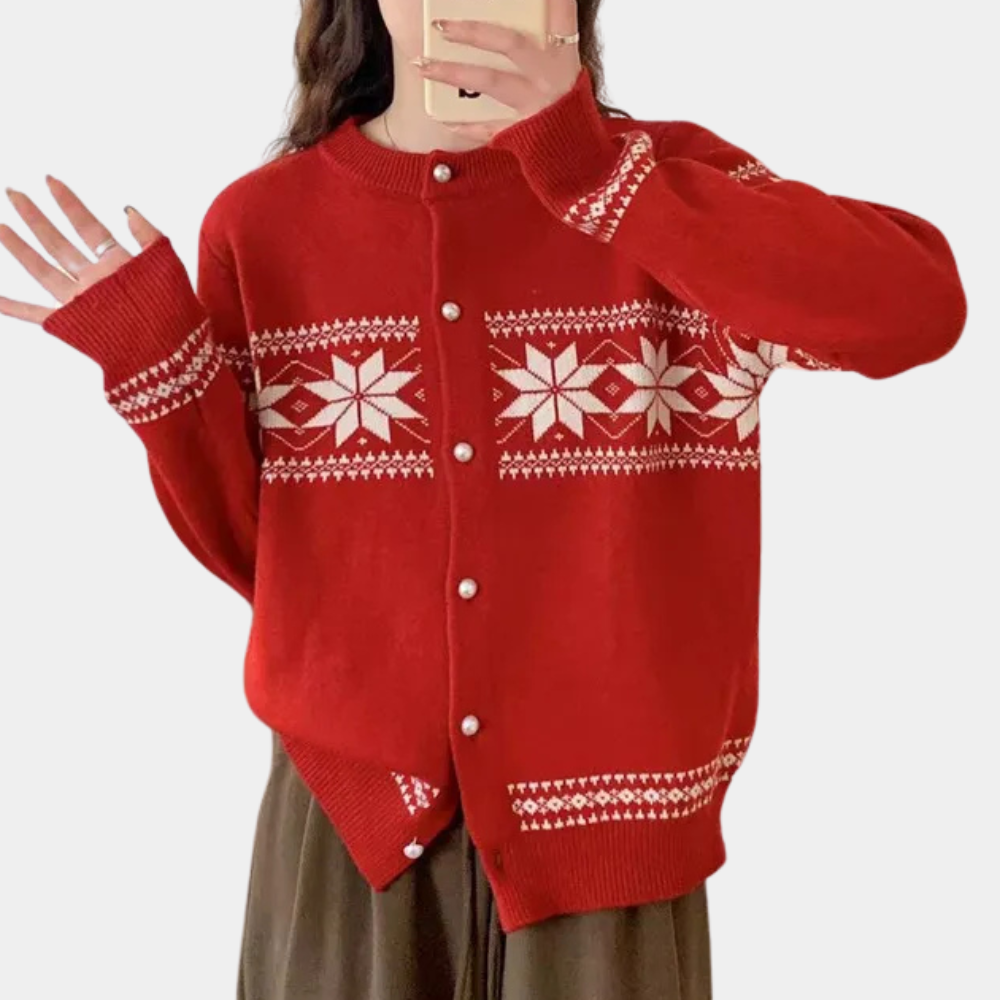 Rode kersttrui met witte sneeuwvlokpatronen, ronde hals en knoopsluiting. Perfect voor feestdagen, wintermode en gezellige outfits.