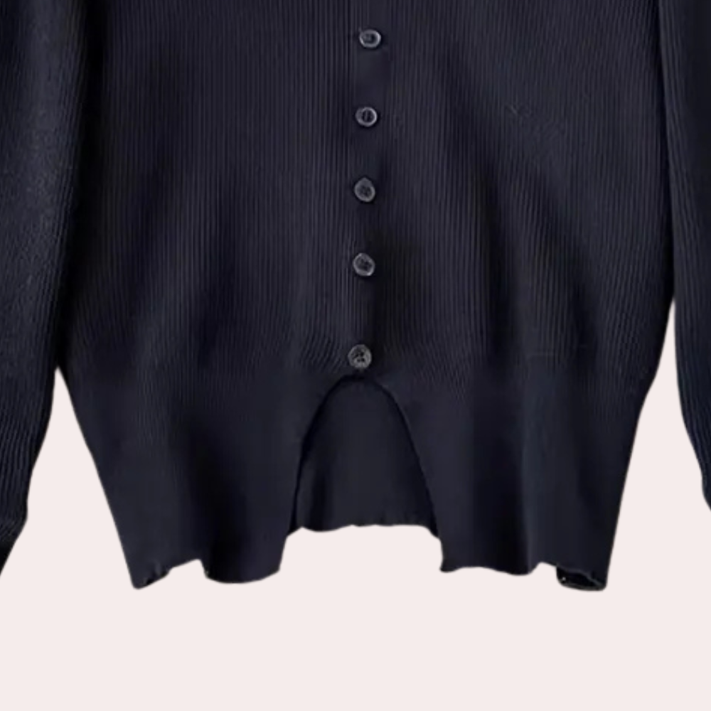 Zwarte gebreide damestrui met knoopsluiting, lange mouwen en geribbelde textuur. Stijlvolle en comfortabele mode voor dagelijks gebruik.