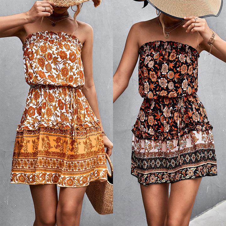 Twee strapless zomerjurken met bloemenprint in oranje en zwart, perfect voor casual en strandoutfits. Trendy damesmode, boho-stijl.