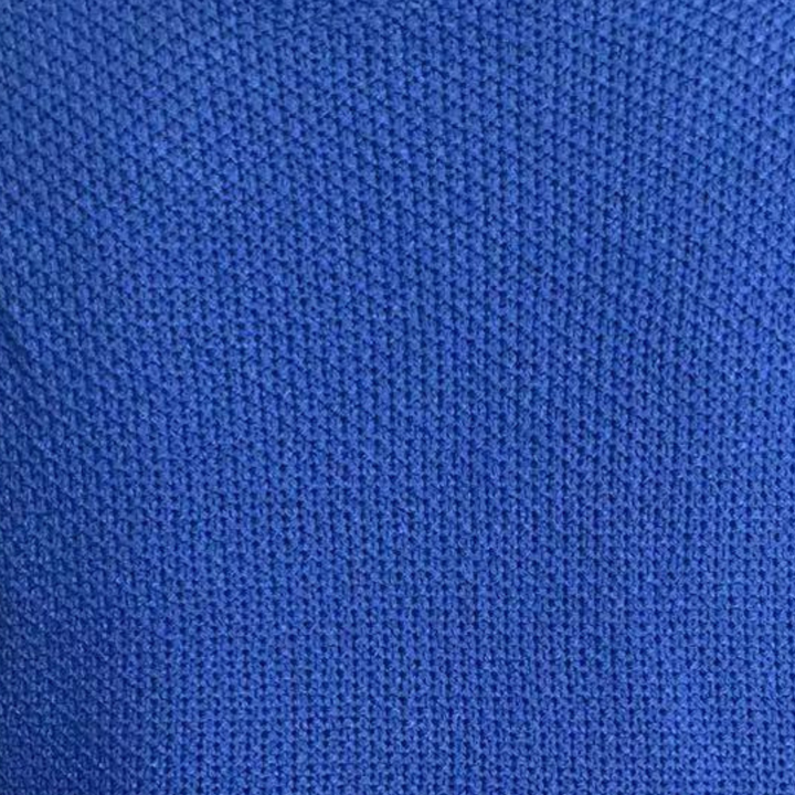 Blauwe gebreide stof textuur, close-up. Perfect voor modeontwerp, breiwerk en textielprojecten. Hoogwaardige, duurzame materialen.