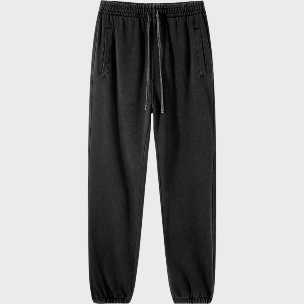 Zwarte joggingbroek met elastische tailleband en trekkoord, comfortabele pasvorm, casual stijl, ideaal voor dagelijks gebruik en sportieve activiteiten.
