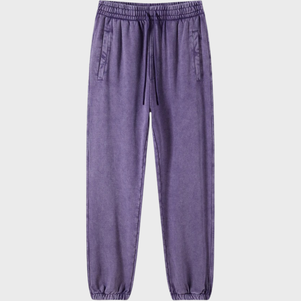 Donkerpaarse joggingbroek met elastische tailleband en trekkoord, zijzakken, comfortabele pasvorm. Perfect voor casual en sportieve looks.
