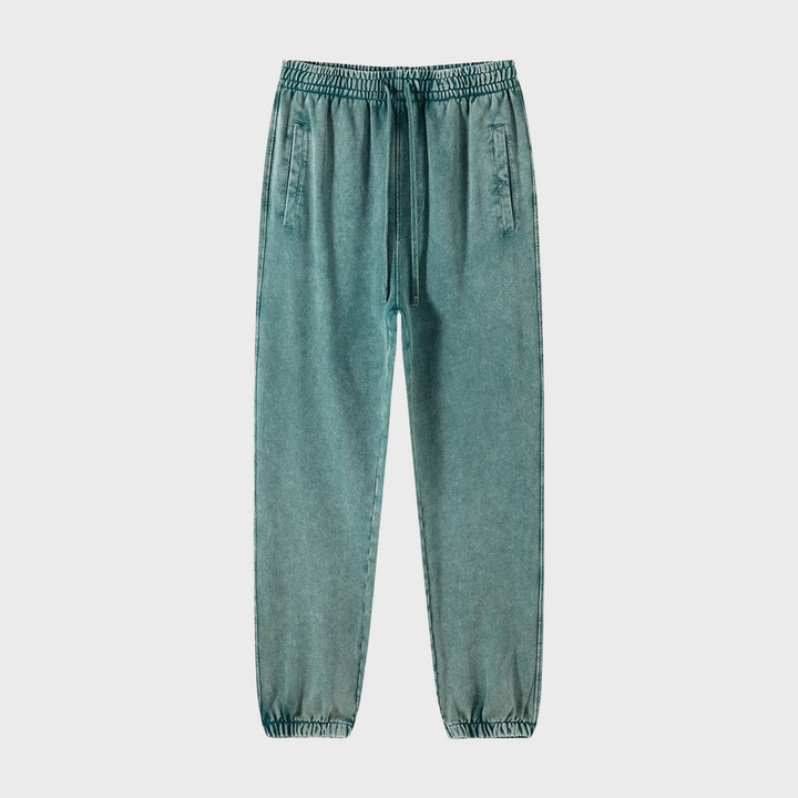 Groene joggingbroek voor dames, elastische tailleband, trekkoord, zijzakken, comfortabele pasvorm, casual sportkleding, modieuze streetwear.