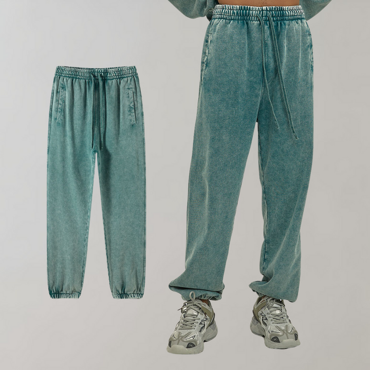 Groene joggingbroek met elastische tailleband en trekkoord, comfortabele pasvorm, casual streetwear, unisex design, perfect voor dagelijks gebruik.