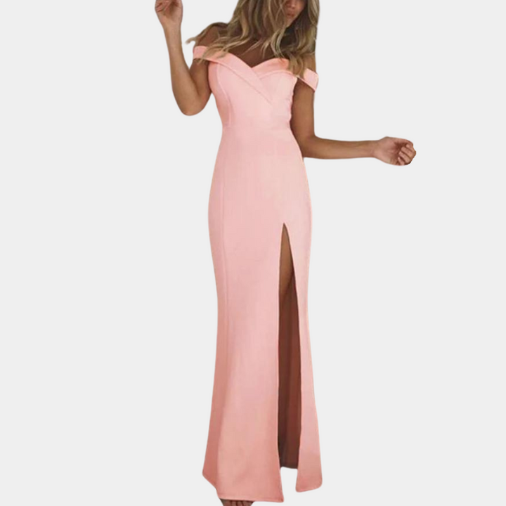 Elegante roze avondjurk met off-shoulder ontwerp en hoge split, perfect voor galafeesten en bruiloften. Stijlvolle damesmode.