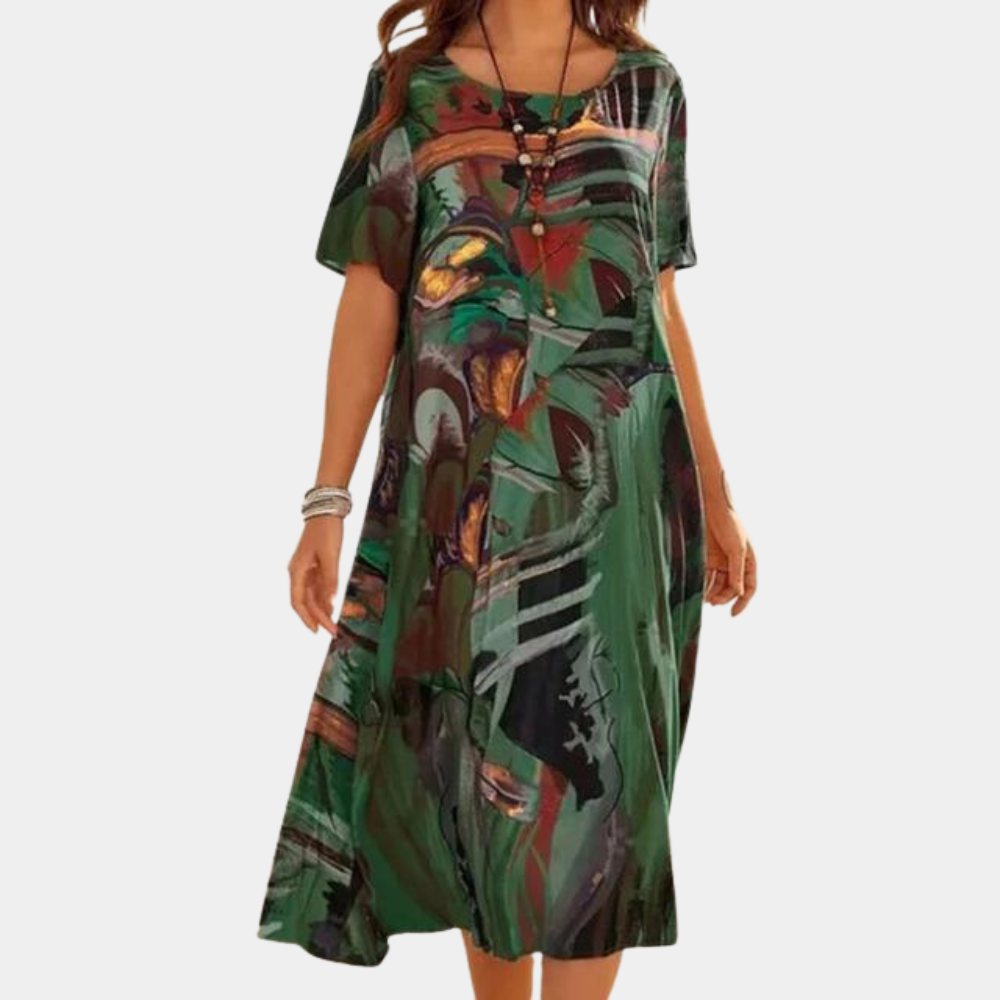 Groene damesjurk met abstracte print, korte mouwen en losse pasvorm. Perfect voor casual zomeroutfits. Comfortabele en stijlvolle mode.