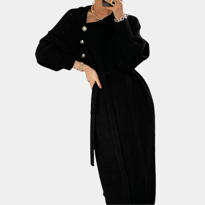 Zwarte damesjurk met lange mouwen, knopen en ceintuur, elegant ontwerp. Perfect voor herfst- en wintermode. Stijlvolle kleding voor dames.