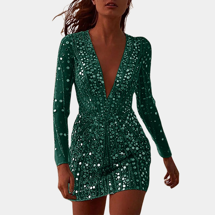 Vrouw in groene paillettenjurk met diepe V-hals, lange mouwen en sprankelend ontwerp. Perfect voor feestelijke gelegenheden en avondkleding.