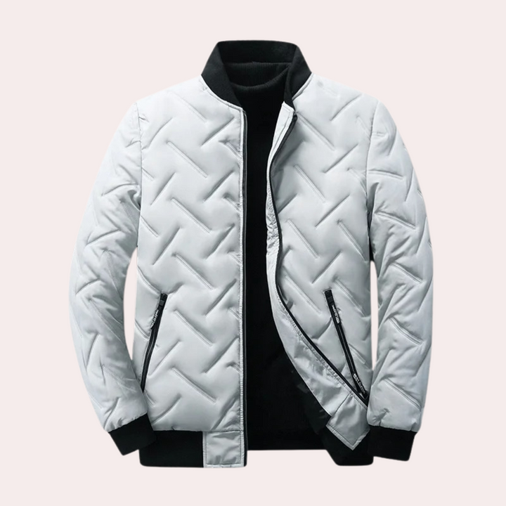 Grijze gewatteerde jas met zwarte kraag en rits, moderne winterjas voor heren, stijlvol en warm, ideaal voor koude seizoenen.