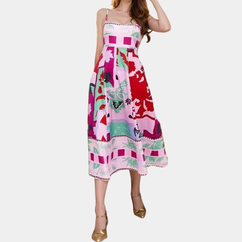 Rode midi-jurk met kleurrijke bloemenprint, mouwloos ontwerp en A-lijn silhouet. Perfect voor zomerse evenementen en casual chique stijl.