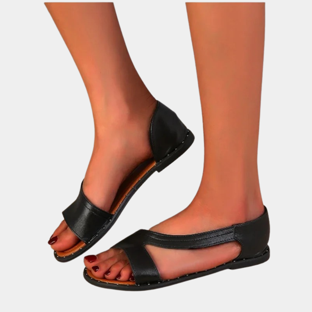 Zwarte leren sandalen voor dames, open teen, lage hak, comfortabel en stijlvol, perfect voor casual zomeroutfits.