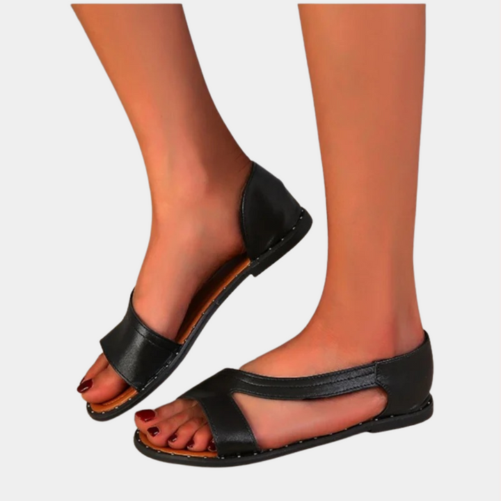 Zwarte leren sandalen voor dames, open teen, lage hak, comfortabel en stijlvol, perfect voor casual zomeroutfits.