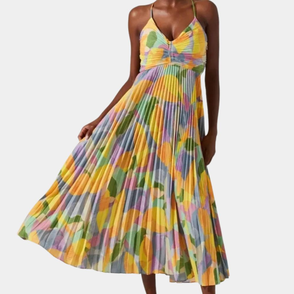 Kleurrijke zomerjurk met abstract patroon, geplooide rok en spaghettibandjes. Perfect voor casual en feestelijke gelegenheden.