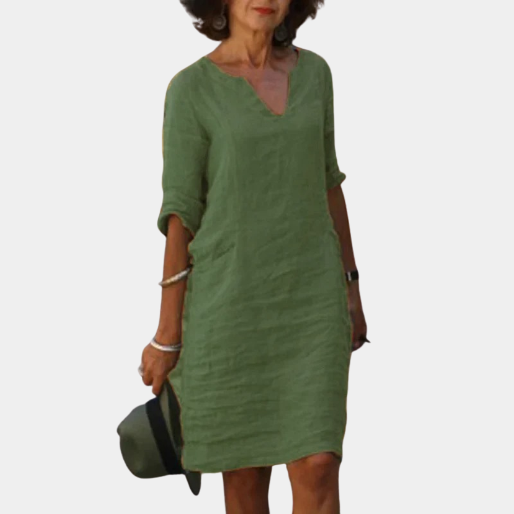Groene linnen jurk voor dames, driekwart mouwen, V-hals, casual stijl. Perfect voor zomeroutfits. Comfortabele en stijlvolle damesmode.