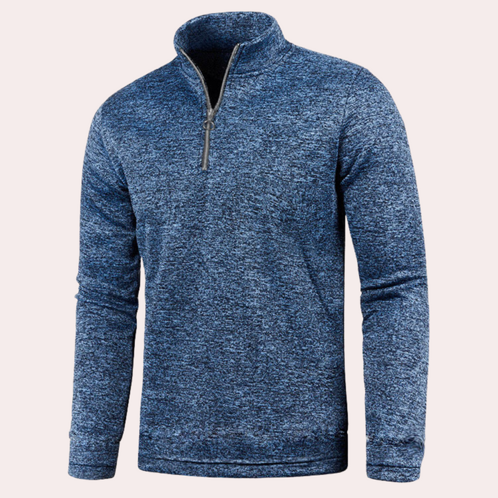 Blauwe herenfleece met halve rits, comfortabele pasvorm, ideaal voor outdooractiviteiten. Perfecte keuze voor casual en sportieve gelegenheden.