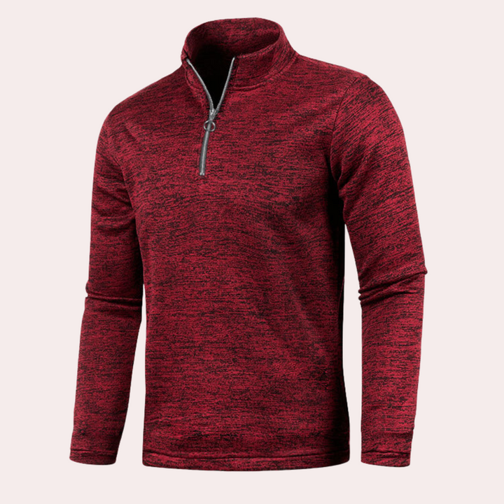 Rode herenfleece met halve rits, lange mouwen en gemêleerd patroon. Ideaal voor outdooractiviteiten en casual gebruik. Comfortabel en stijlvol.