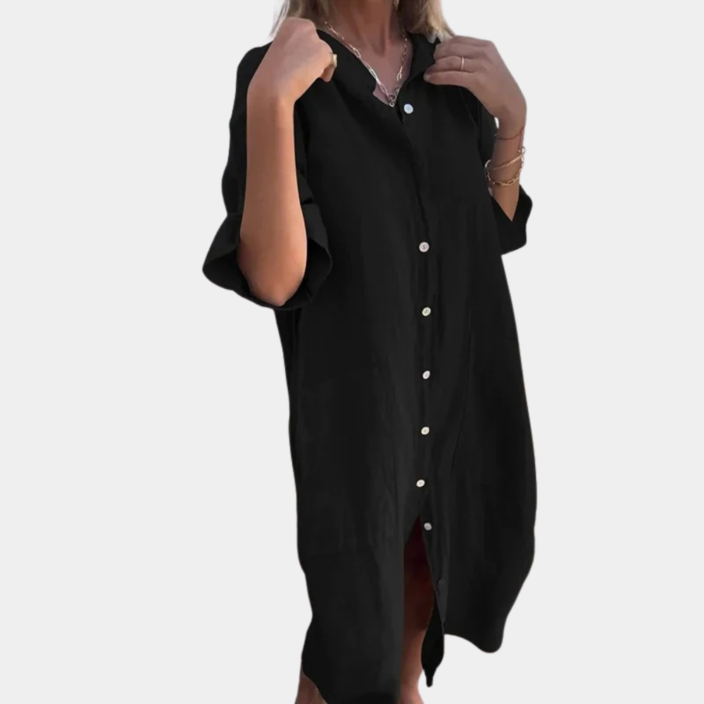 Zwarte oversized damesjurk met knoopsluiting, driekwart mouwen en casual pasvorm. Perfect voor zomeroutfits en modieuze vrijetijdskleding.