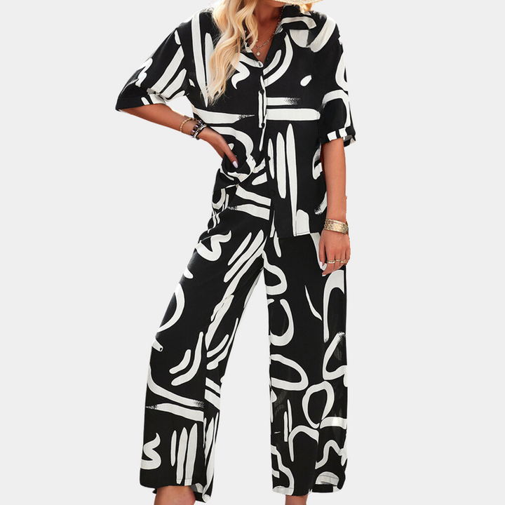 Zwart-wit abstract patroon dames jumpsuit, korte mouwen, losse pasvorm, modieuze casual outfit, geschikt voor zomer en lente.