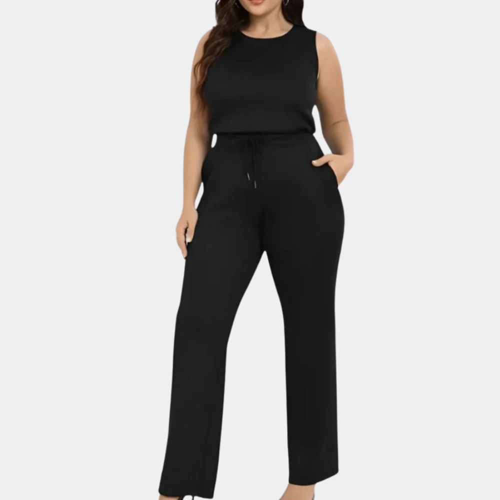 Zwarte dames jumpsuit met wijde pijpen en mouwloos ontwerp, ideaal voor casual en formele gelegenheden. Comfortabele pasvorm, trendy mode.