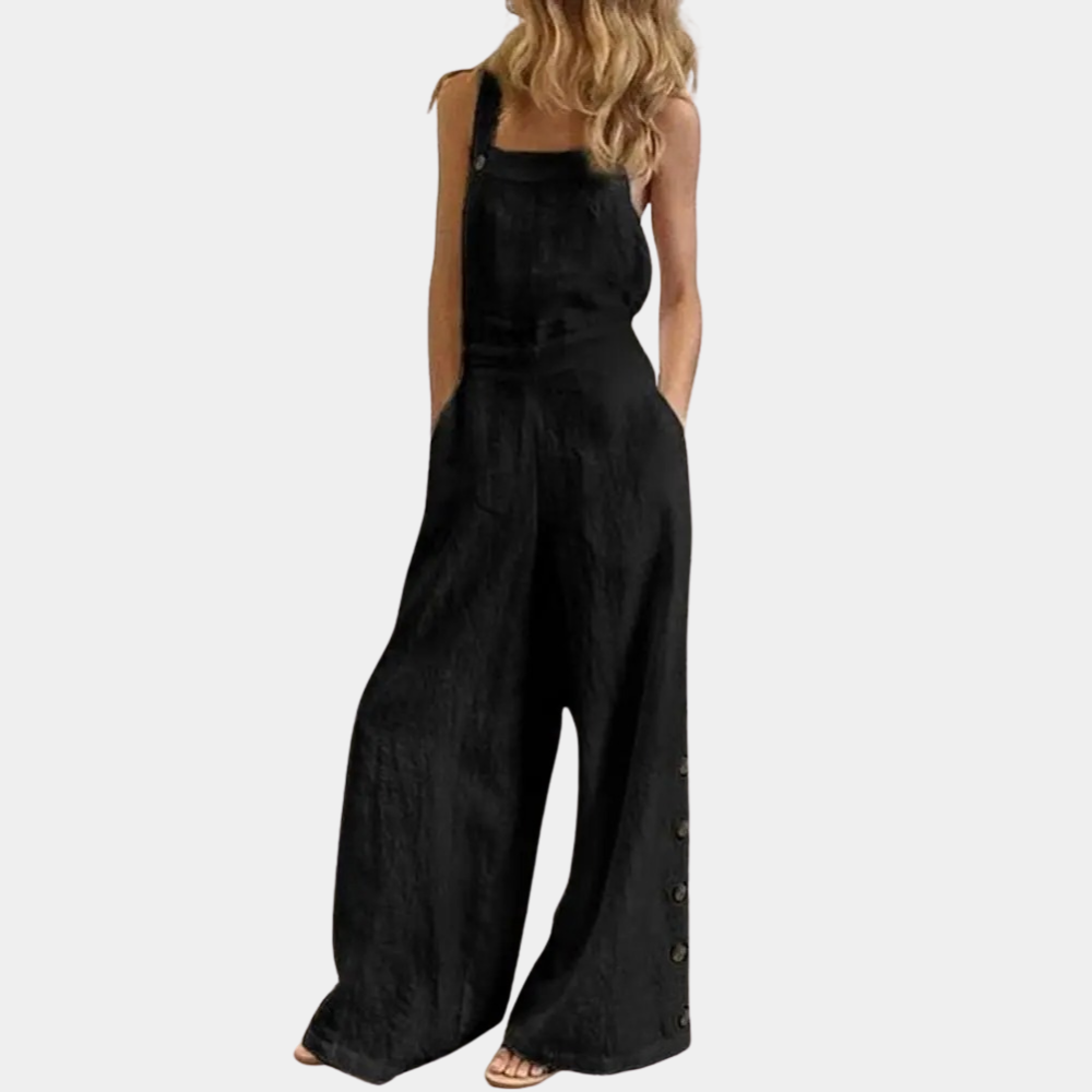 Zwarte dames jumpsuit met wijde pijpen, knoopdetails en verstelbare schouderbanden. Modieuze en comfortabele outfit voor casual en chique gelegenheden.