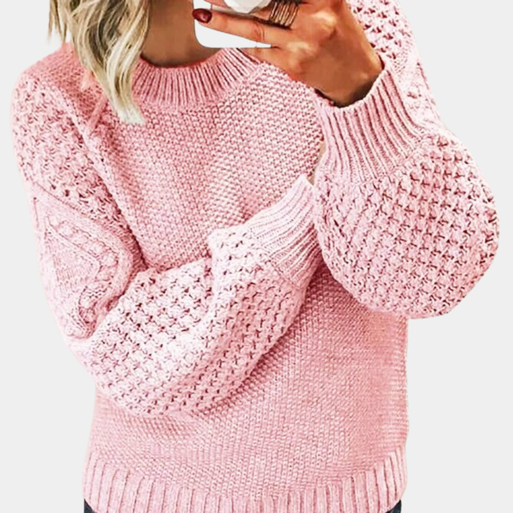 Roze gebreide damestrui met textuur, lange mouwen en ronde hals. Modieuze winterkleding, comfortabel en stijlvol voor dagelijks gebruik.