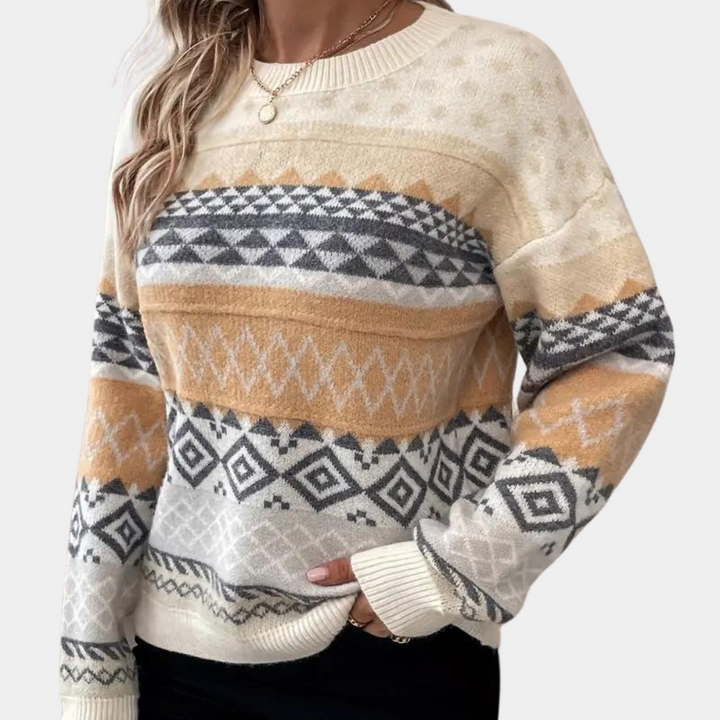 Beige damestrui met geometrisch patroon, lange mouwen en ronde hals. Perfect voor herfstmode. Comfortabele en stijlvolle gebreide kleding.
