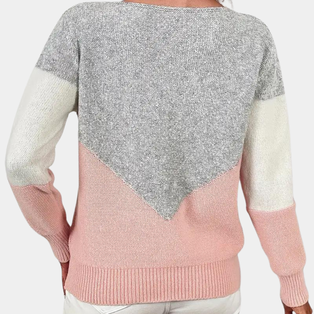 Grijze en roze damestrui met geometrisch patroon, lange mouwen en ronde hals. Modieuze gebreide trui, ideaal voor casual en stijlvolle outfits.