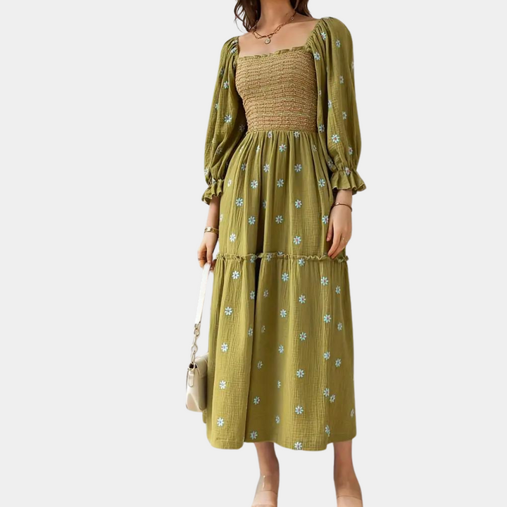 Groene maxi-jurk met bloemenprint, lange pofmouwen en gesmokte top. Perfect voor lente- en zomermode. Elegante dameskleding.