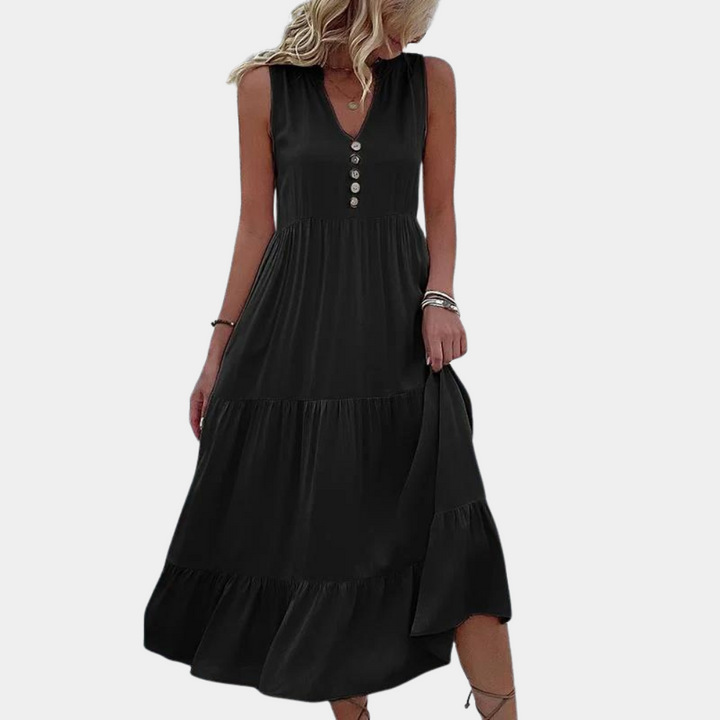 Zwarte maxi-jurk met knoopsluiting, mouwloos ontwerp, V-hals en geplooide rok. Perfect voor zomermode en casual gelegenheden.