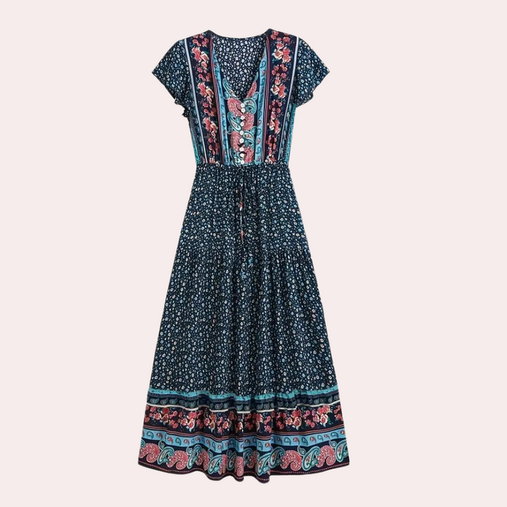 Boho maxi-jurk in marineblauw met bloemenprint, korte mouwen en V-hals. Perfect voor zomerse dagen en casual outfits.