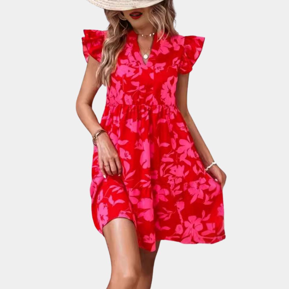 Vrouw in rode bloemenjurk met ruches, zomermode, strandstijl, elegante casual outfit, trendy dameskleding, Madara-ontwerp.