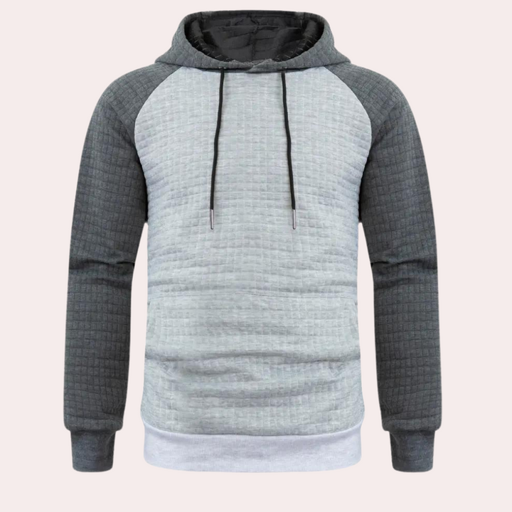 Donkergrijze en lichtgrijze herenhoodie met capuchon, lange mouwen en trekkoorden. Comfortabele casual kleding, ideaal voor dagelijks gebruik.