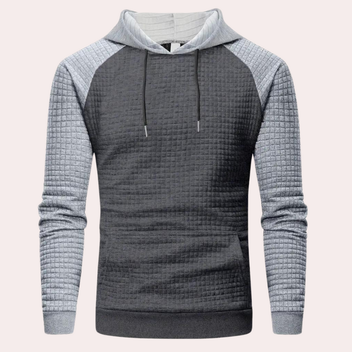 Grijze herenhoodie met geruite textuur, lange mouwen en capuchon. Comfortabele casual trui, ideaal voor herfst- en wintermode.