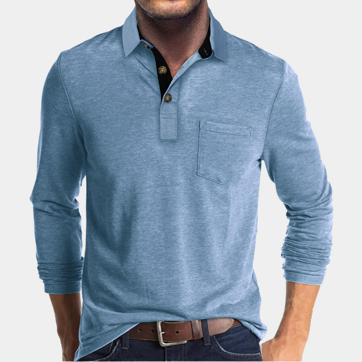 Blauwe herenpolo met lange mouwen, borstzak en knoopsluiting. Casual en stijlvolle herenkleding, ideaal voor dagelijks gebruik en comfort.