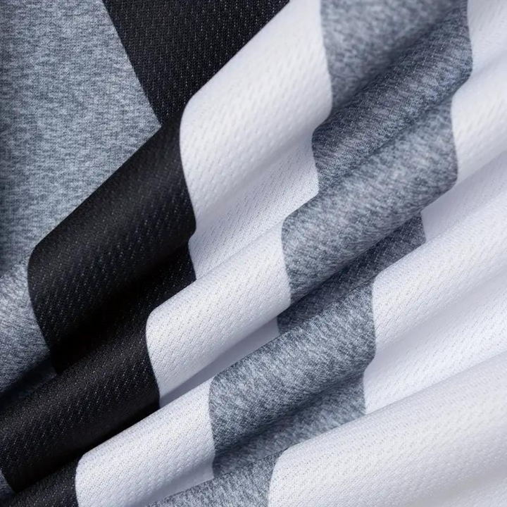 Grijze en witte geruite stof, close-up textuur, geschikt voor mode en interieur, hoogwaardige textielmaterialen, moderne stijl.
