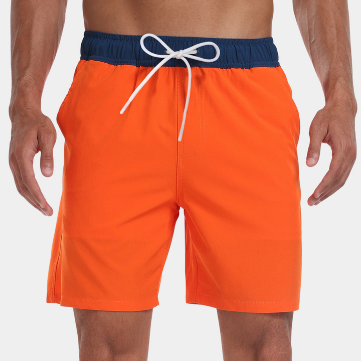 Oranje zwembroek voor heren met blauwe tailleband en witte veter, ideaal voor strand en zwembad. Comfortabele pasvorm, modieus en functioneel.