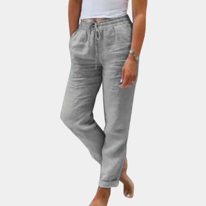 Grijze linnen broek voor dames, comfortabel met elastische tailleband en trekkoord, casual en stijlvol, perfect voor zomerse outfits.